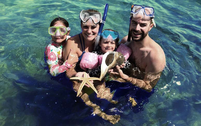 Family snorkeling at Shell Island