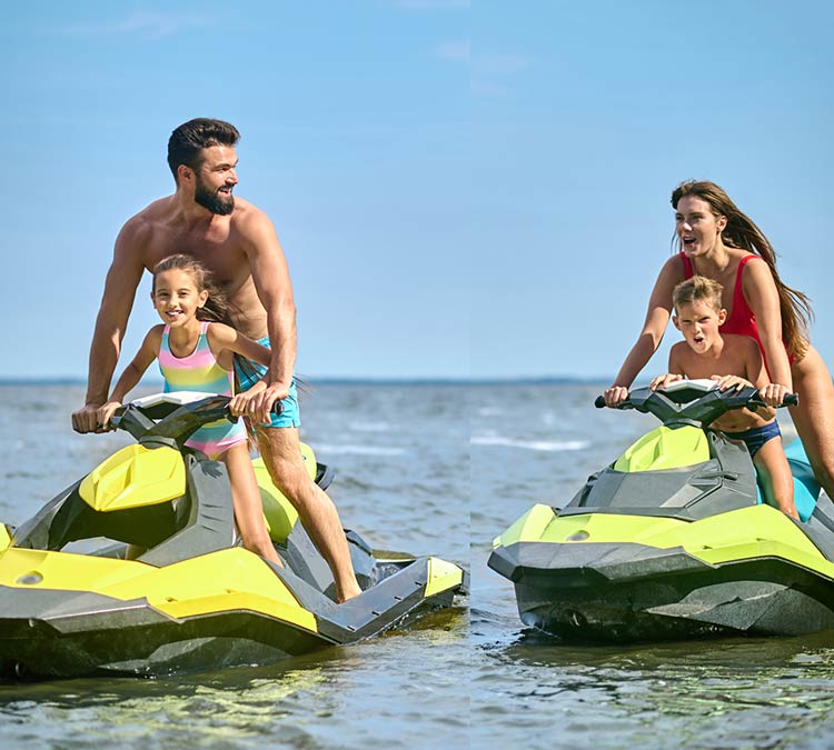 Two jetskis with one parent and one kid on each jetski.